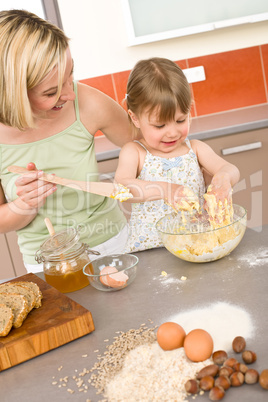 Baking - Woman with child preparing dough