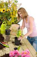 Gardening - woman sprinkling water to plant