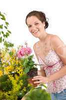 Gardening - woman holding flower pot