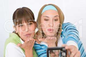 Two young woman taking picture