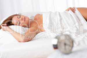 White lounge - Woman sleeping in white bed