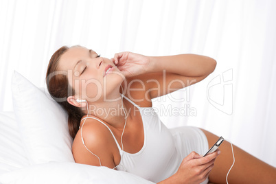 Young woman holding mp3 player