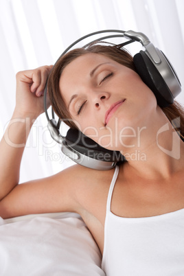 Woman with closed eyes enjoying music