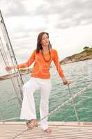 Attractive woman sailing on luxury yacht