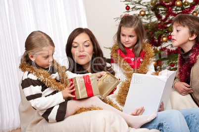 Happy family: mother with three children