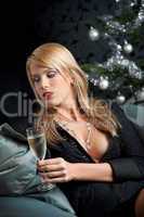 Blond woman with glass of champagne on Christmas