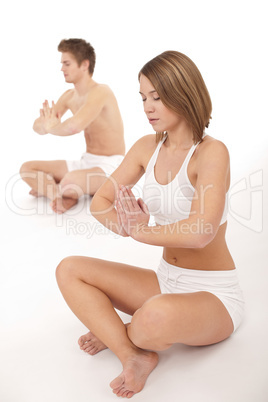 Fitness - Healthy couple stretchin in yoga position