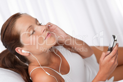 Young woman holding mp3 player