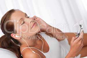 Young woman holding mp3 player