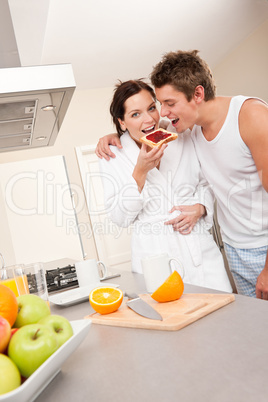 Young man and woman eating toast