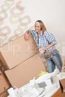 Moving house: Happy woman with box