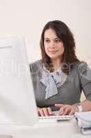 Young business woman working at office