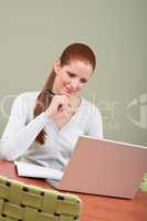 Long red hair  business woman with laptop