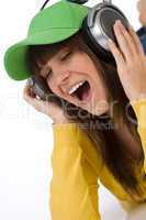 Female teenager enjoy music with headphones
