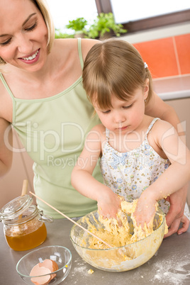 Baking - Woman with child preparing dough