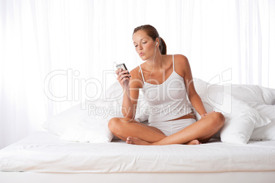 Young woman holding mp3 player