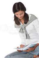 Teenager holding book and reading