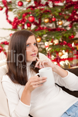 Brown hair woman relaxing with coffee on Christmas