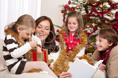 Happy family: mother with three children