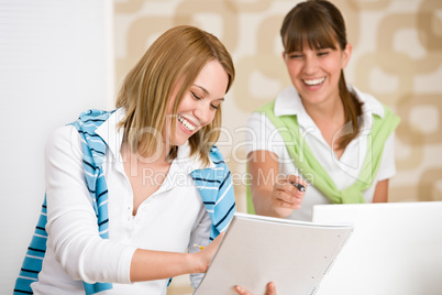 Student at home - two happy woman with laptop