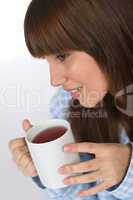 Female teenager with cup of tea for breakfast