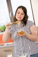 Bake - happy woman with ingredients in kitchen