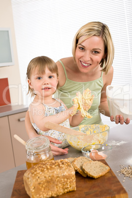 Baking - Woman with child preparing dough