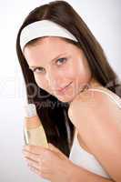 Body care - woman holding shampoo