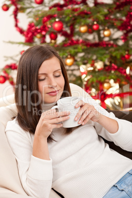 Brown hair woman relaxing with coffee on Christmas