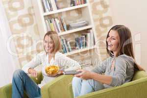 Students - Two female teenager watching television