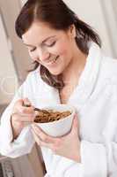 Happy woman holding cereals for breakfast