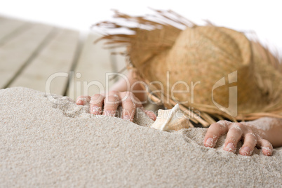 Naked woman sunbathing on beach