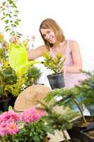 Gardening - woman pouring water to plant