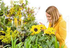Gardening - portrait of woman with sunflowers