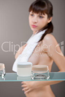 Body care: Young woman in bathroom