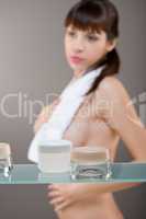 Body care: Young woman in bathroom