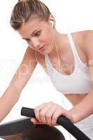 Fitness series - Woman with headphones cycling