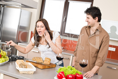 Cooking - happy couple in modern kitchen