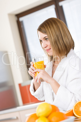 Breakfast - Smiling woman with fresh orange juice