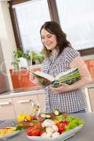 Cook - Plus size happy woman holding cookbook