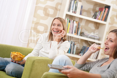 Students - Two female teenager watching television