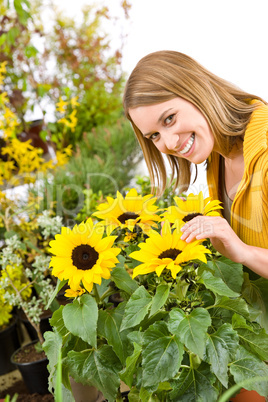 Gardening - portrait of woman with sunflowers