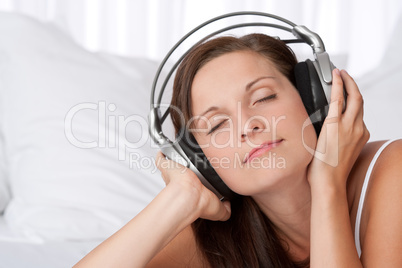 Young woman enjoying music with headphones