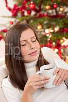 Brown hair woman relaxing with coffee on Christmas