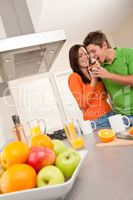 Happy couple drinking coffee in the kitchen