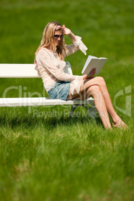 Spring and summer - Young woman relaxing in meadow