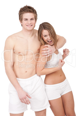 Fitness - Young sportive smiling couple on white