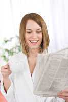 Breakfast - happy woman reading newspaper drink coffee