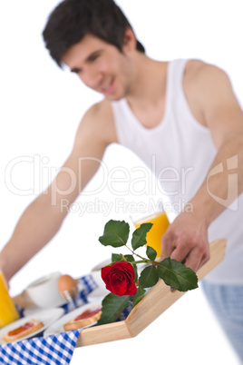 Breakfast - young man holding tray with rose