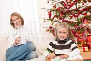 Happy blond woman with child on Christmas